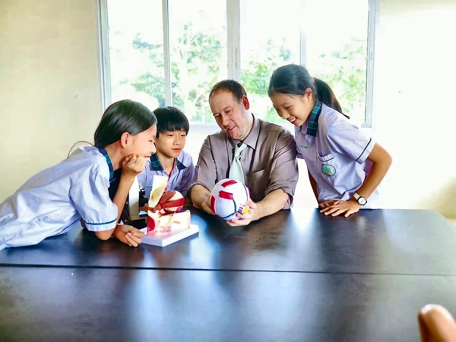 A teacher exploring science models with students